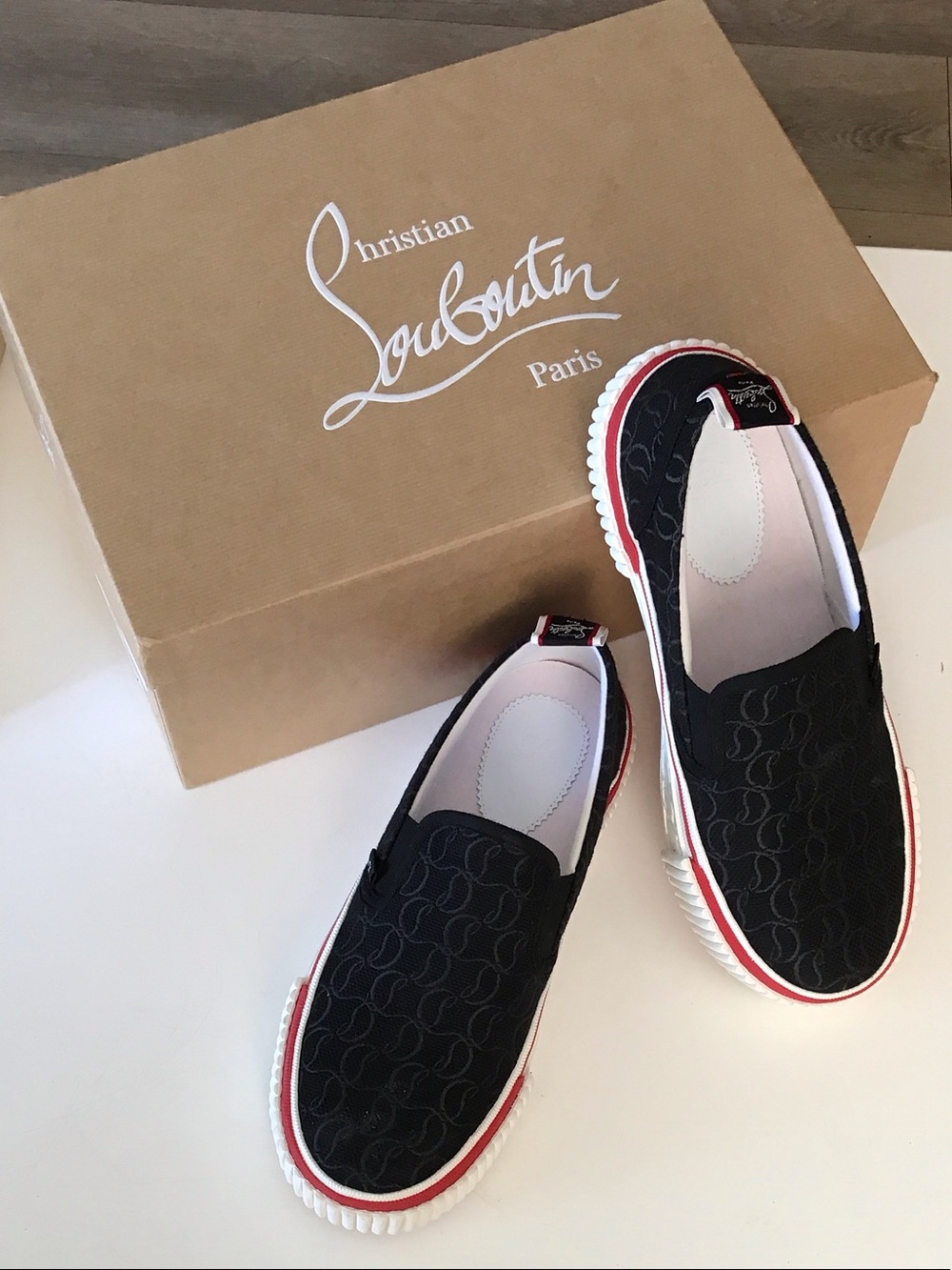 Christian Louboutin  Black Slip-On Sneakers with Red Trim